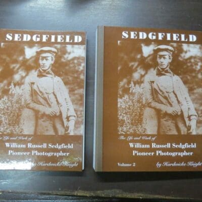 Hardwicke Knight, Sedgfield, The Life and Work of William Russell Sedgfield, Pioneer Photographer, author published, Dunedin, 1998, 2 ringbound volumes in slipcase, 196 pages + unpaginated plates  + 2 posters of publication, 31 cm x 24 cm, History, Photography, Dead Souls Bookshop, Dunedin Book Shop Condition - water-staining, staining, rubbing, loss, creasing, bumping, soiling, age-toning, foxing, scuffing to slipcase, bruising, scuffing, soiling, bumping, age-toning to covers of both volumes, gauging to edge of the cover of volume 1, foxing, age-toning, soiling, rubbing to prelims and fore-edges of textblock, creasing from ring-binding to the textblocks of both volumes